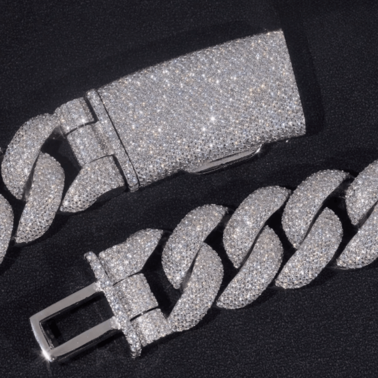 A close-up of the Moissanite Cuban Links Chain 25mm, crafted from 925 sterling silver and encrusted with sparkling moissanite stones, displayed on a black background.
