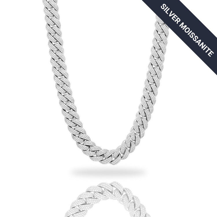 The Moissanite Cuban Links Chain 25mm, crafted from 925 sterling silver, is shown on a white background with thick, interlocking links and a reflective surface below. "SILVER MOISSANITE" appears in the top right corner.