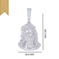 The Moissanite Jesus Religious Pendant is crafted in sterling silver, featuring Jesus with a crown of thorns and VVS moissanite stones. It measures 68.2 x 38.6 mm and has a gold ribbon accent at the top left corner.