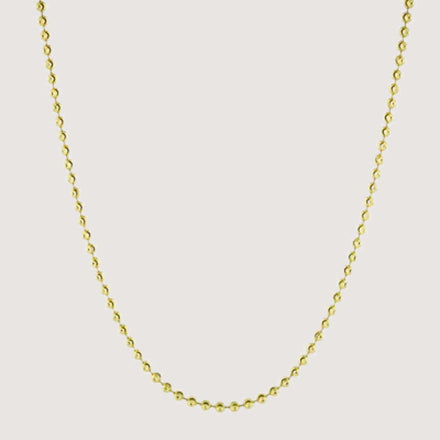The Moon Cut Bead Chain-2mm features evenly spaced small round beads along a solid gold chain, displayed on a plain light background.