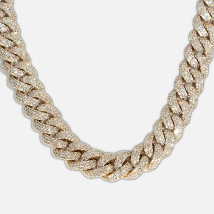 Close-up of the Natural Diamond Cuban Link Chain - 13mm, crafted in 10k solid gold with each link encrusted with sparkling natural diamonds, displayed on a plain white background.