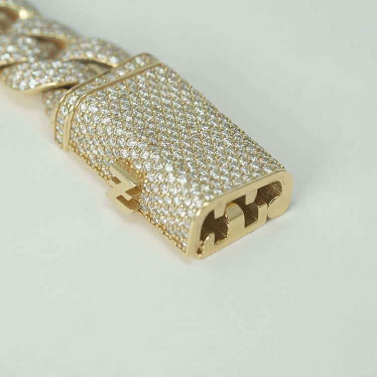 Close-up of the Natural Diamond Cuban Link Chain - 13mm clasp in solid 10k gold, encrusted with natural diamonds. The open clasp reveals its detailed locking mechanism, set against a plain white background.