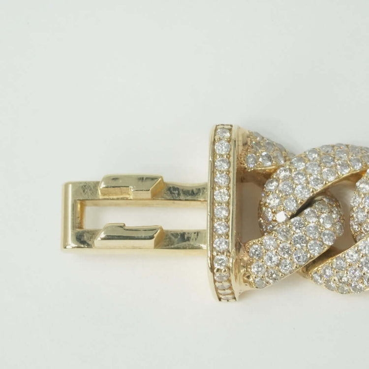 A close-up of the Natural Diamond Cuban Link Chain - 13mm, featuring a 10k solid gold clasp set with small natural diamonds, attached to a thick Iced-Out Cuban Link and shown against a plain white background.