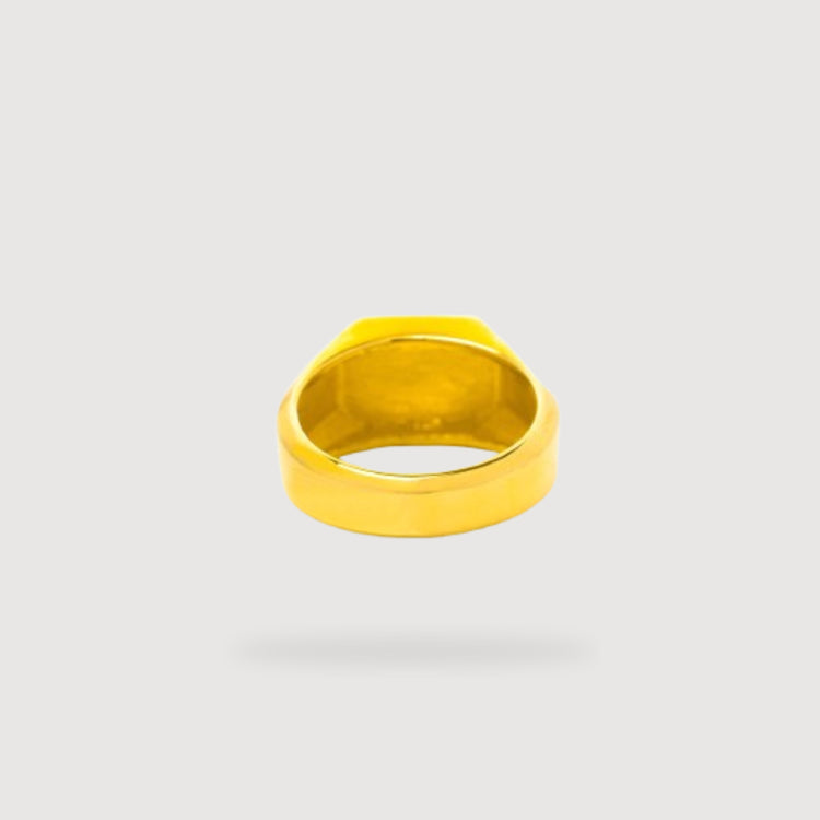 The Octagon Signet Ring in Solid Gold is displayed on a light gray background, viewed from below to showcase its smooth, polished circular band.