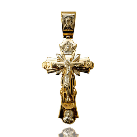 The Orthodox Cross Pendant - 14K Gold showcases intricate engravings of Jesus, religious symbols, and saintly figures—a striking piece that honors the traditions of Orthodox Christianity.