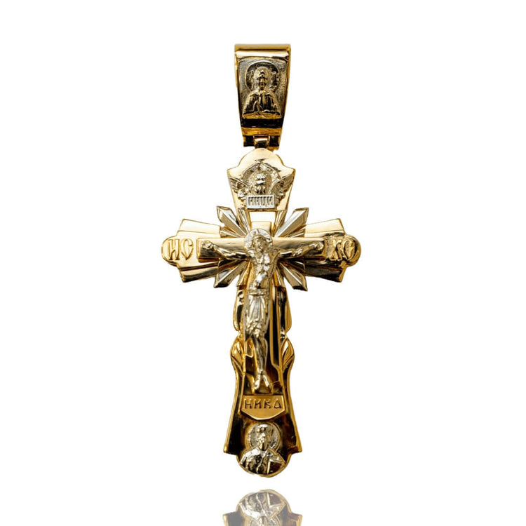 The Orthodox Cross Pendant - 14K Gold showcases intricate engravings of Jesus, religious symbols, and saintly figures—a striking piece that honors the traditions of Orthodox Christianity.