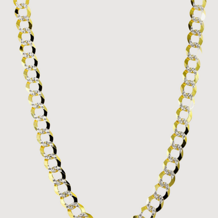 A close-up of the Pavé Curb Link Chain - 7mm - 13mm Solid Yellow Gold shows its large, flat, interlocking links and sparkling pavé details set against a plain white background.