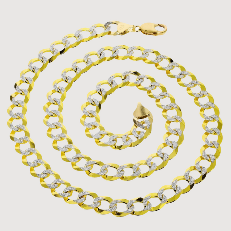 The Pavé Curb Link Chain (7mm-13mm) in solid yellow gold is coiled in a spiral on a white background, showcasing its luxurious design and lobster clasp closure.