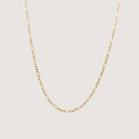 The Pave Figaro Chain 9.5mm in solid yellow gold is displayed against a plain, light background.