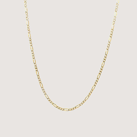 gold Figaro chain with pavé-set diamonds, perfect for timeless luxury.