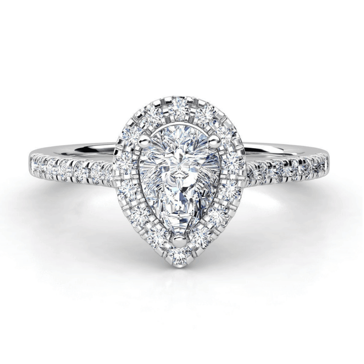 The Pear-Shaped Halo Lab Diamond Engagement Ring with Pavé Band features a pear-shaped lab diamond center, a halo of smaller diamonds, and a pavé band set in white gold.