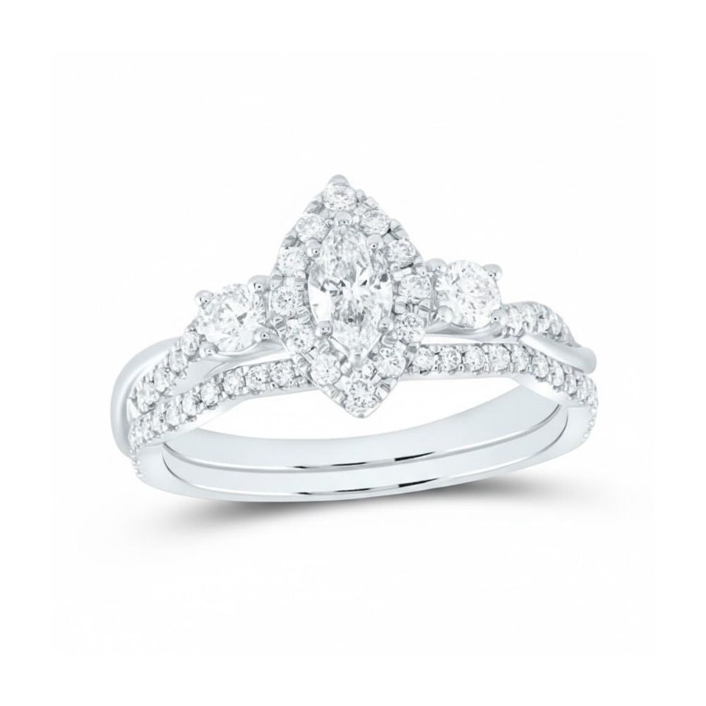 The 14k White Gold Marquise Diamond Halo Bridal Set features a marquise diamond center, surrounded by a halo and complemented by additional round and pavé-set diamonds on both bands.