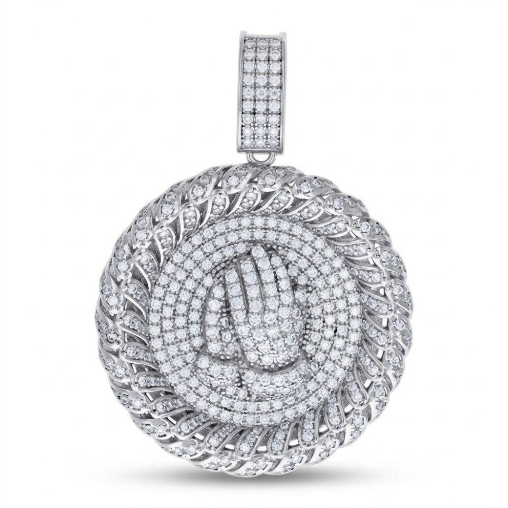 The Sterling Silver Moissanite Praying Hands Pendant features a round 925 sterling silver design with sparkling moissanite stones and a detailed praying hands motif at the center.