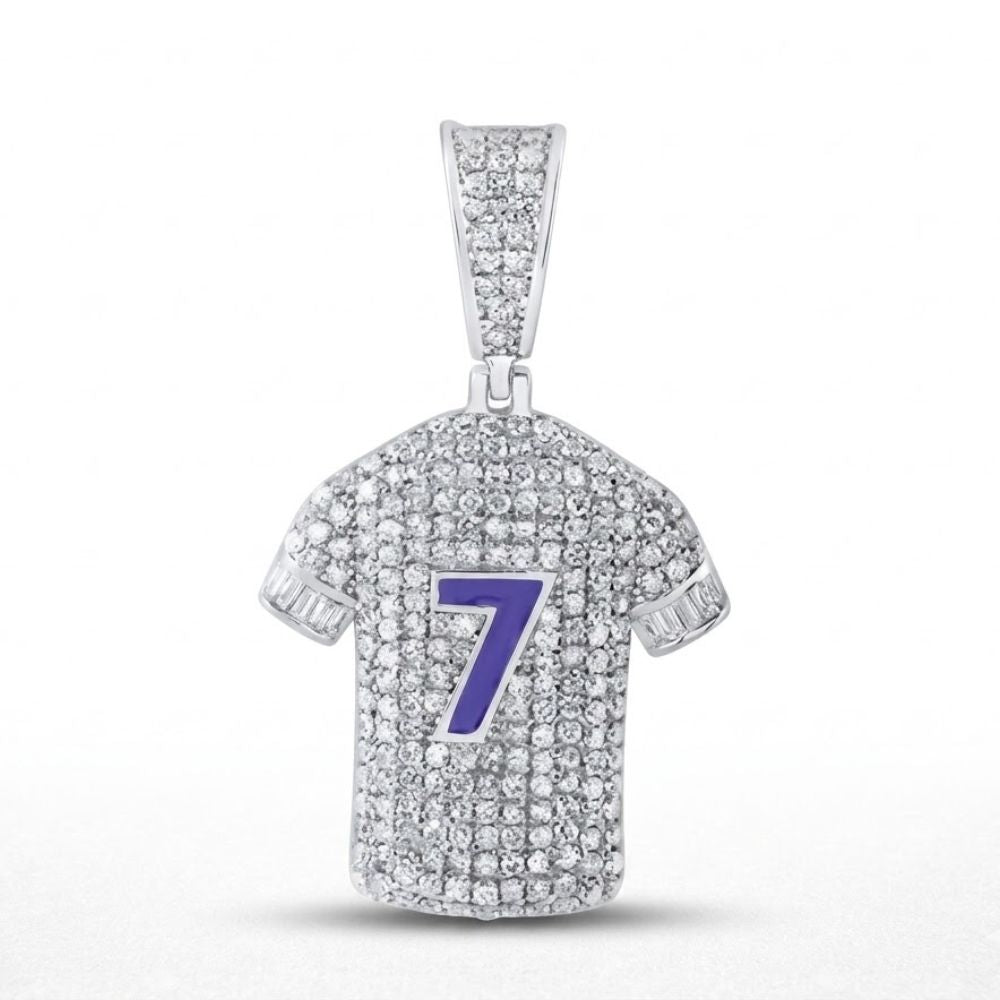 The Sterling Silver Diamond Number 7 Jersey Charm (1.25 CTW) features a jersey-shaped pendant with sparkling diamonds, a bold blue number 7 on the front, and a diamond-encrusted bail for attaching to your chain.