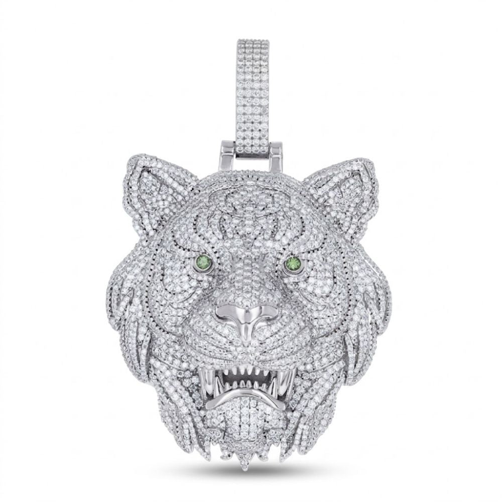 The Men’s Sterling Silver Moissanite Tiger Head Pendant features sparkling stones, green gemstone eyes, detailed facial features with bared teeth, and a textured mane—all set against a white background.