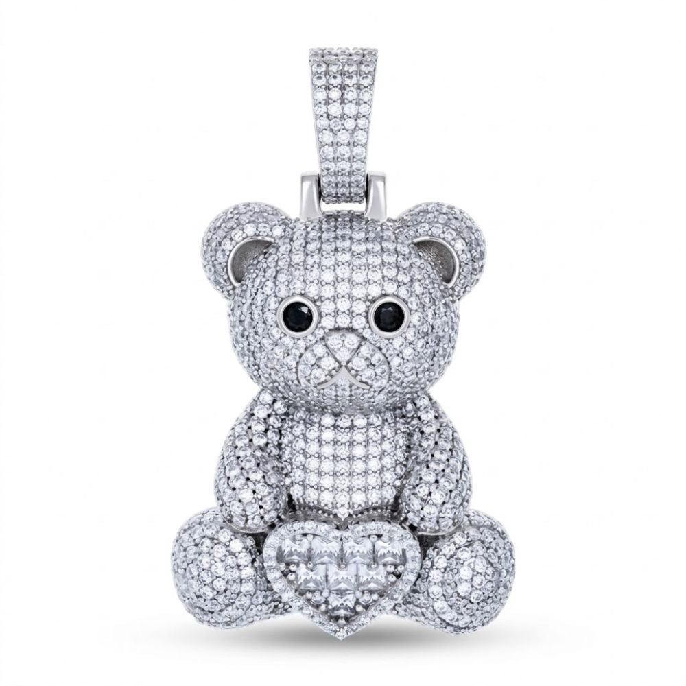 The Sterling Silver Moissanite Teddy Bear Heart Pendant features sparkling black and white moissanite, gemstone eyes, a diamond-studded heart, and a moissanite pendant bail for a dazzling touch.
