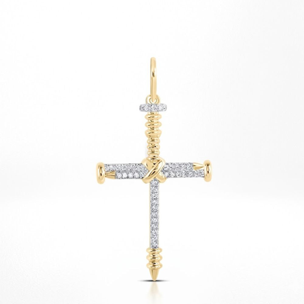 The 10K Gold Diamond Nail Cross Charm Pendant 1/5 CTW features a cross design with screw-shaped ends and a circular gold loop, blending sparkling diamonds and gold for an elegant, faith-inspired look.