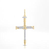 The 10K Gold Diamond Nail Cross Charm Pendant 1/5 CTW features a cross design with screw-shaped ends and a circular gold loop, blending sparkling diamonds and gold for an elegant, faith-inspired look.