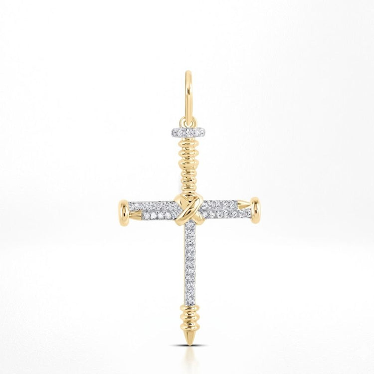 The 10K Gold Diamond Nail Cross Charm Pendant 1/5 CTW features a cross design with screw-shaped ends and a circular gold loop, blending sparkling diamonds and gold for an elegant, faith-inspired look.