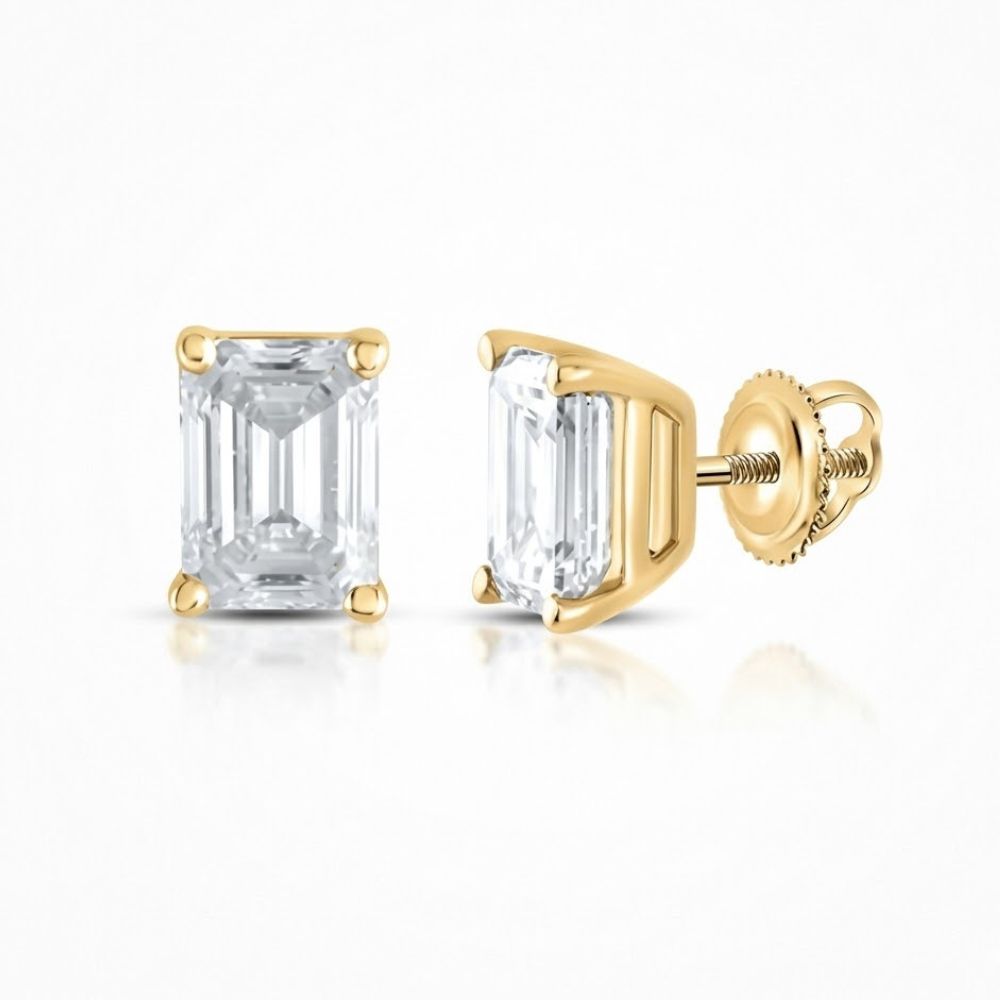 The 14K Yellow Gold 1/4 CTW Emerald Solitaire Earrings feature emerald-cut diamonds in four-prong settings with screw-back posts, elegantly displayed on a white background.