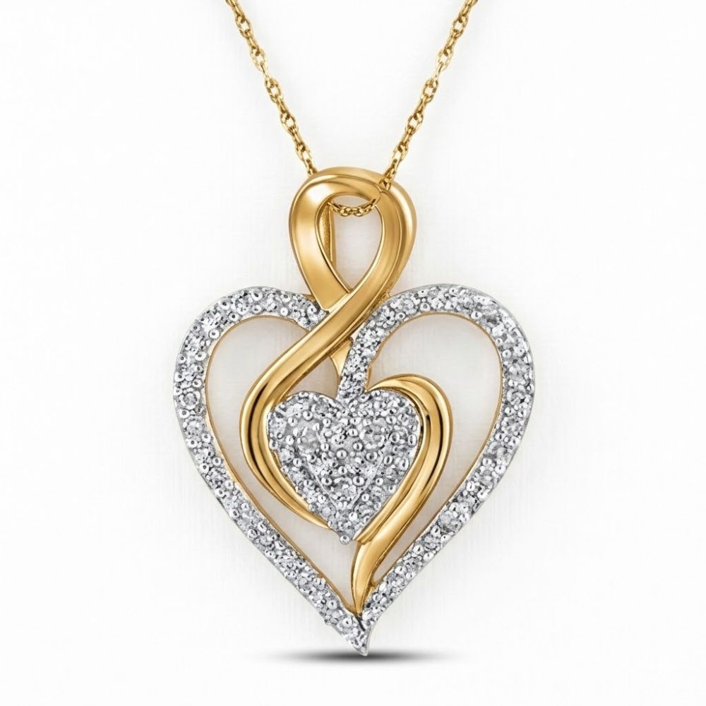 The 10K Yellow Gold Diamond Heart Pendant 1/4 CTW showcases an open gold heart encrusted with diamonds and a smaller diamond heart at the center for a stunning, romantic look.