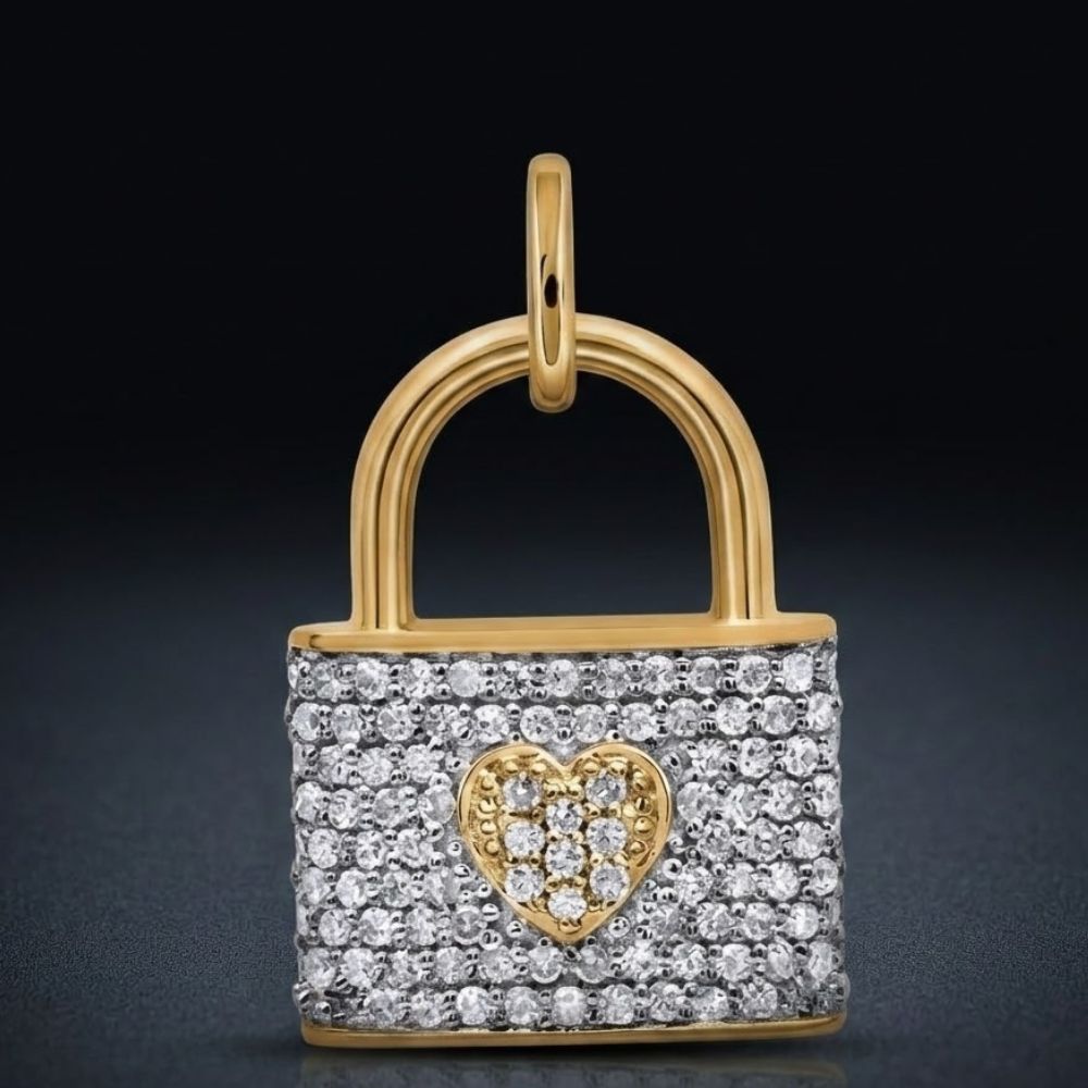 The 1/4CTW Natural Diamond Heart Lock Pendant Gift in 10K yellow gold features a sparkling heart design set with natural diamonds, gleaming beautifully against a dark background.