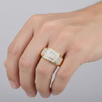 A close-up of a hand wearing the 10K Yellow Gold Diamond Square Ring 1/4CT, showcasing its bold square design set with sparkling diamonds, set against a plain light gray background.