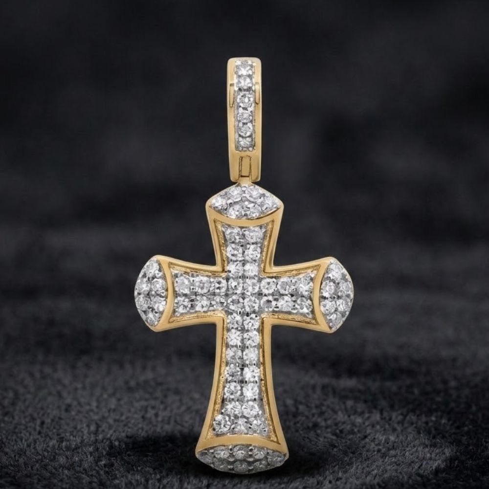 The 3/8CTW Diamond Cross Pendant in 10K Gold features natural diamonds set in gold, showcased against a soft black background.