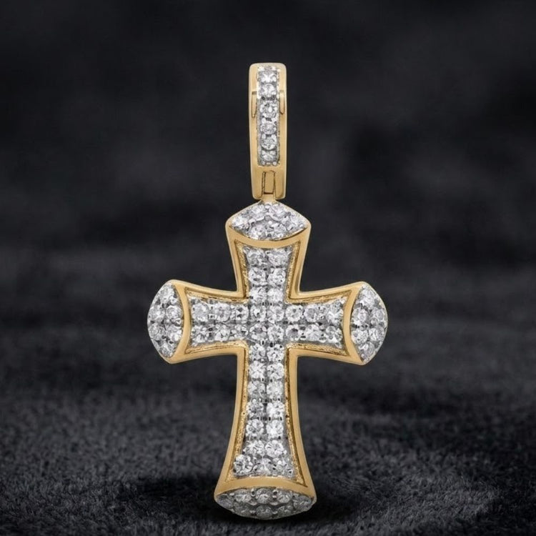 The 3/8CTW Diamond Cross Pendant in 10K Gold features natural diamonds set in gold, showcased against a soft black background.