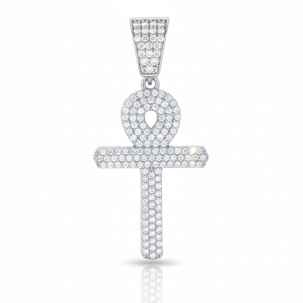 The Moissanite Egyptian Ankh Cross is a sterling silver pendant featuring clear gemstones. Inspired by ancient Egyptian jewelry, its unique looped cross design and matching stone-adorned bail stand out against a white backdrop.