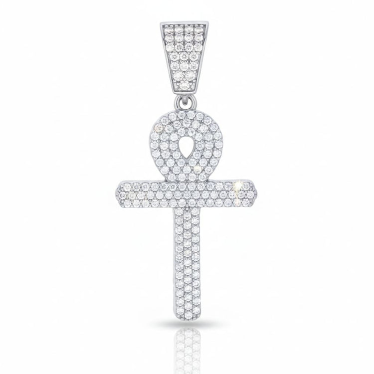 The Moissanite Egyptian Ankh Cross is a sterling silver pendant featuring clear gemstones. Inspired by ancient Egyptian jewelry, its unique looped cross design and matching stone-adorned bail stand out against a white backdrop.