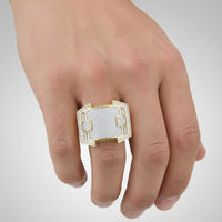 A hand showcases the 10K Yellow Gold Diamond Cluster Ring | 5/8 CTTW, featuring a bold rectangular shape and sparkling diamonds, worn on the middle finger against a neutral background.