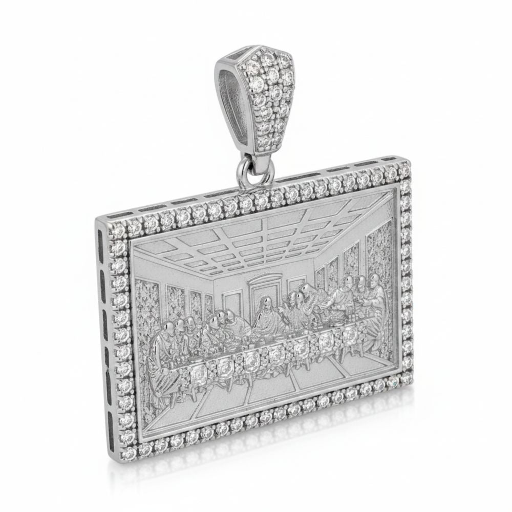 A rectangular sterling silver pendant features an engraved Last Supper, bordered by sparkling stones and an embellished bail—a striking piece of faith jewelry called the Baguette Round Moissanite Last Supper.