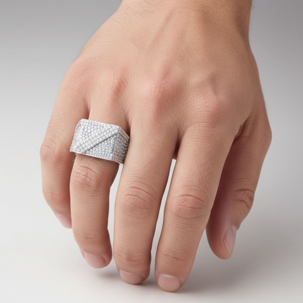 A hand wears the Moissanite Square Head Fashion Ring—a large, square sterling silver ring set with sparkling moissanite stones—on the middle finger, against a neutral background.