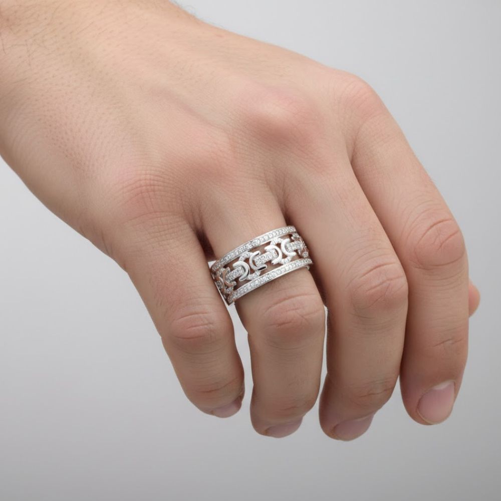 A close-up of a hand wearing the 1/3 CT Natural Diamond Men’s Ring in Sterling Silver, featuring a chain-link design with embedded natural diamonds, set against a plain light background.