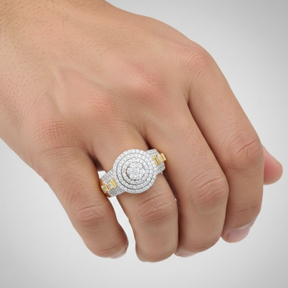 A hand displays the 10k Two-Tone Gold Diamond Circle Flower Ring, featuring concentric rows of sparkling diamonds and gold accents, set against a light background.