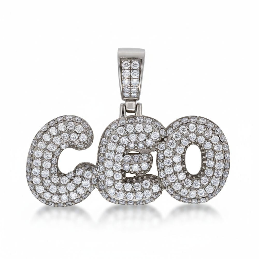 The Moissanite CEO Fashion Charm Pendant showcases the word "CEO" adorned with sparkling stones and a diamond-studded bail, creating an eye-catching sterling silver jewelry piece.