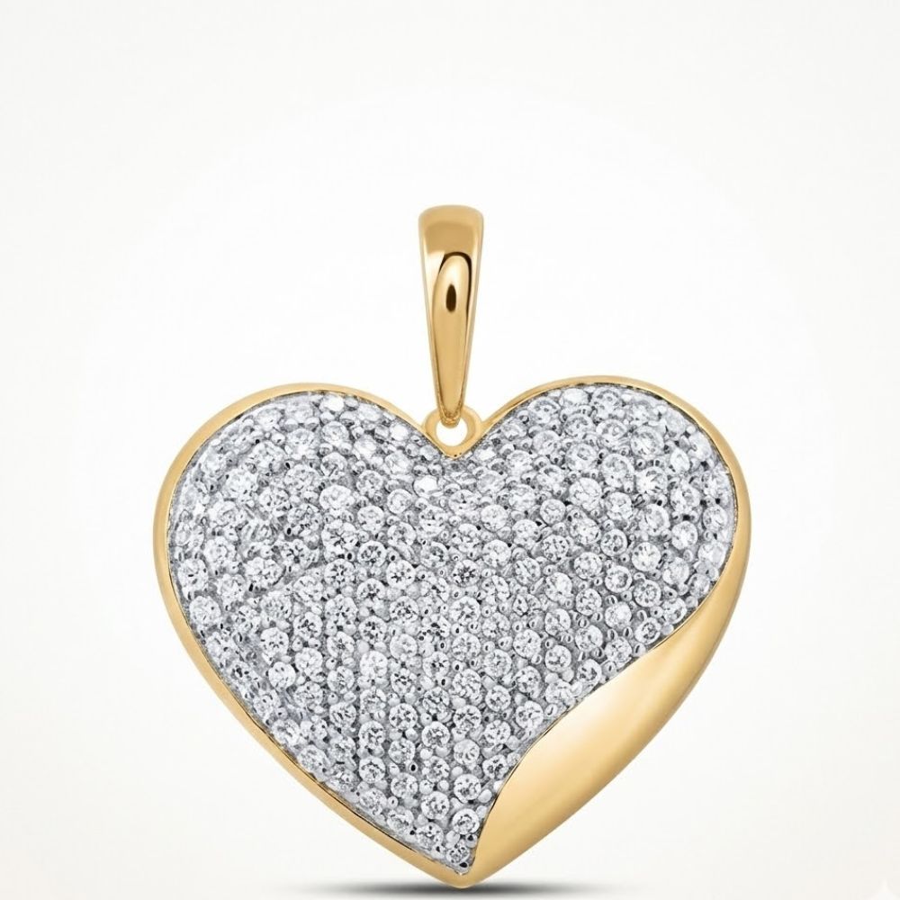 The 10K Yellow Gold 1 CTW Natural Diamond Heart Pendant features a heart-shaped design with sparkling diamonds on the front, a smooth gold accent on one edge, and a gold bail for attaching to your favorite chain.