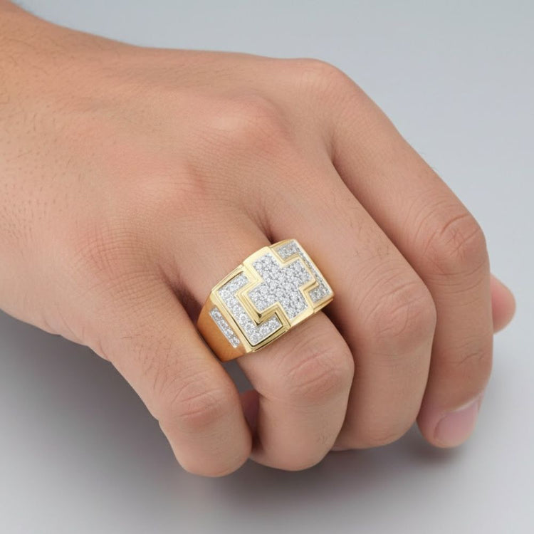 A hand shows off the 10k Gold Diamond Cross Cluster Ring 1/3 Cttw, featuring a geometric design with sparkling round diamonds, set against a neutral background.