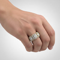 A hand wears two Diamond Band – 2.05 CT Baguette and Pavé Design rings on the middle and ring fingers, set against a plain light background.