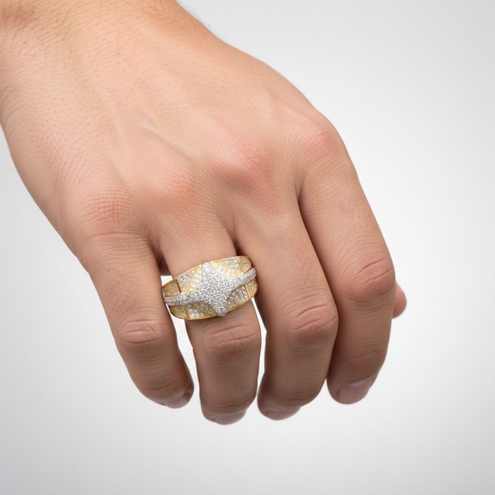 A close-up of a hand wearing the 1.57 CTW Natural Diamond Cluster Ring, crafted in 14k yellow gold with a star design, is shown against a plain light background.