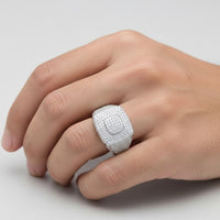 A close-up of a hand wearing the Moissanite Square Head Fashion Ring—its large, rectangular silver design sparkles with small gems against a plain light background, creating a striking modern statement piece.