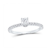 The 14k White Gold Round Diamond Solitaire Bridal Ring features a round diamond solitaire in a prong setting, with a band accented by sparkling smaller diamonds.