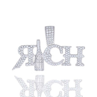 The Moissanite RICH Fashion Charm Pendant features diamond-studded letters spelling "RICH" with a champagne bottle as the I, photographed on a white background with its reflection—a true luxury statement piece.