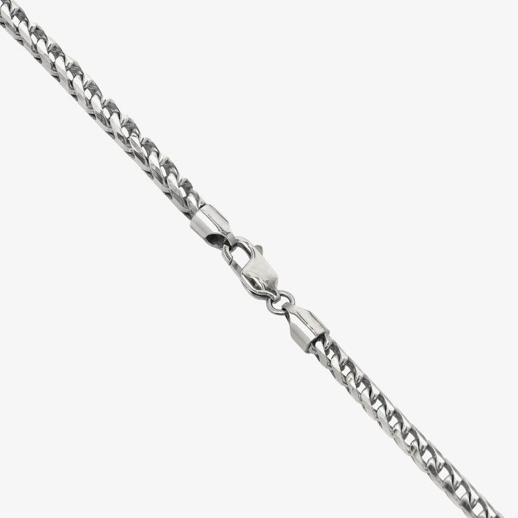 A close-up of the Franco Chain White Gold - 10k 3.5MM, featuring a lobster clasp, laid diagonally on a white background and ready to ship.