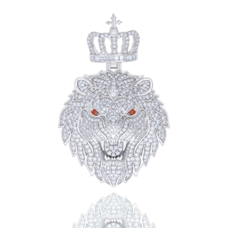 The Red Eyes Moissanite Lion Head Pendant, crafted from 925 sterling silver, features VVS moissanite eyes, a jeweled crown, and diamond-encrusted details, all gleaming against a white background with intricate shimmer and faint reflections.