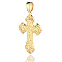 The Regal Patterned Gold Cross Pendant features intricate engravings and a polished 24K gold finish, set against a white background with a subtle reflection, symbolizing divine protection.