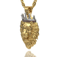 The Regal Lion Pendant with Crown - 14k Gold features a detailed lion's mane and a silver crown set with red gemstones, hanging from a thick gold chain against a white background.