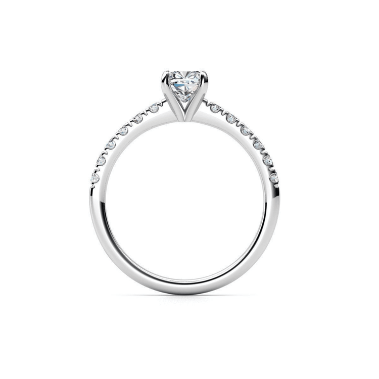 The Round-Cut Solitaire Lab Diamond Engagement Ring features a round lab diamond in a prong setting with small diamonds on the upper half of its white gold band, shown against a white background.