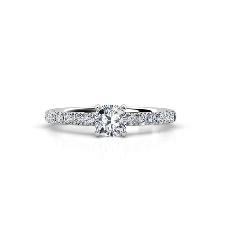 The Round-Cut Solitaire Lab Diamond Engagement Ring features a brilliant lab diamond in a four-prong white gold setting and a sparkling diamond-accented band, creating an elegant choice for women.
